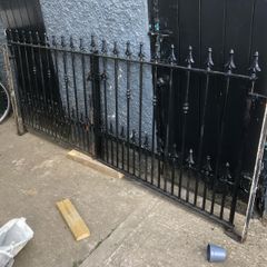 Set of wrought iron driveway gates and side gate