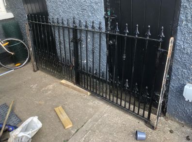 Set of wrought iron driveway gates and side gate
