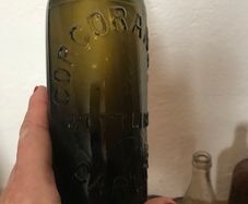 4 assorted Vintage glass bottles.