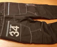 Jeans black denim Next with big back pockets white stitch and print details loose fit brand new pants trousersheight 140cm 10years