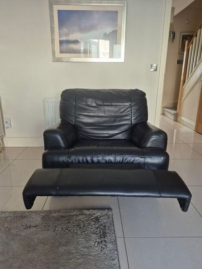Black leather corner sofa and recliner chair