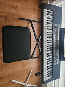 Barely used 61 keys  keyboard with stand and stool in perfect condition, model no SM-61K
