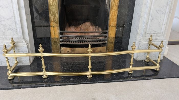 Brass fireplace fender and companion set