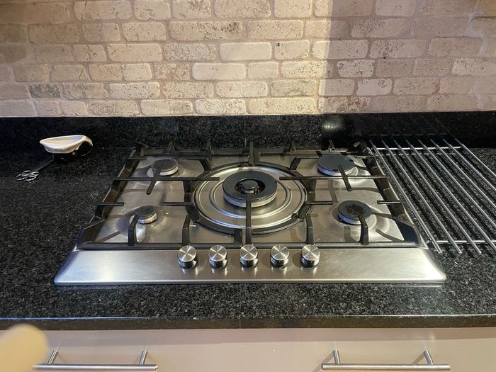 Entire kitchen Quartz work top solid wooden shaker style doors