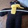 Hand knitted black teddy bear with yellow scarf Image 5