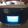 vintage Amstrad CDTV50, a portable boombox featuring a built-in CRT television, radio, and CD player. Image 3