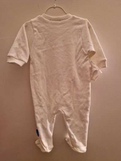 A selection of brand new baby clothes and items