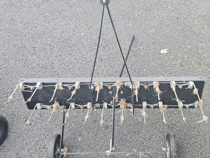 Tow behind lawn dethatcher