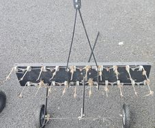 Tow behind lawn dethatcher