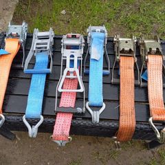 Tensioners for the transport belt