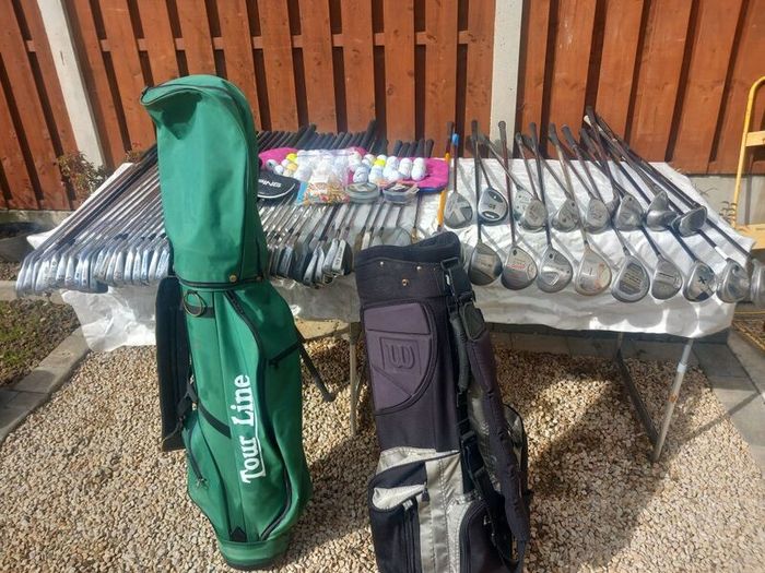 A selection of golf clubs and bags. Golf balls