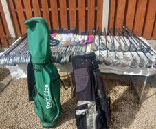 A selection of golf clubs and bags. Golf balls