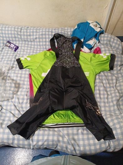 2 cycling shirts 1 is cube worth easily 50 euro and is brand new and pants with padding for on the saddle brand new never worn the second shirt is the official astana team training shirt also brand new  is the  would like to sell all together for a good p