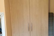 Double wardrobe with hanging rails and shelving
