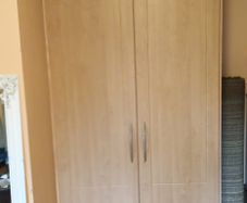 Double wardrobe with hanging rails and shelving