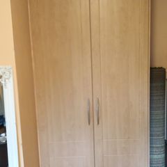 Double wardrobe with hanging rails and shelving