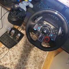 Two Logitech steering wheels G29 and G920