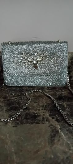 silver sandals and bag