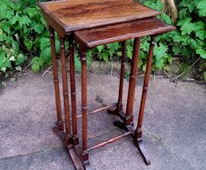 Antique pair of nesting tables