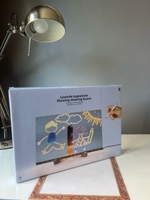 Drawing glowing art board with markers