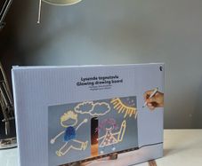 Drawing glowing art board with markers