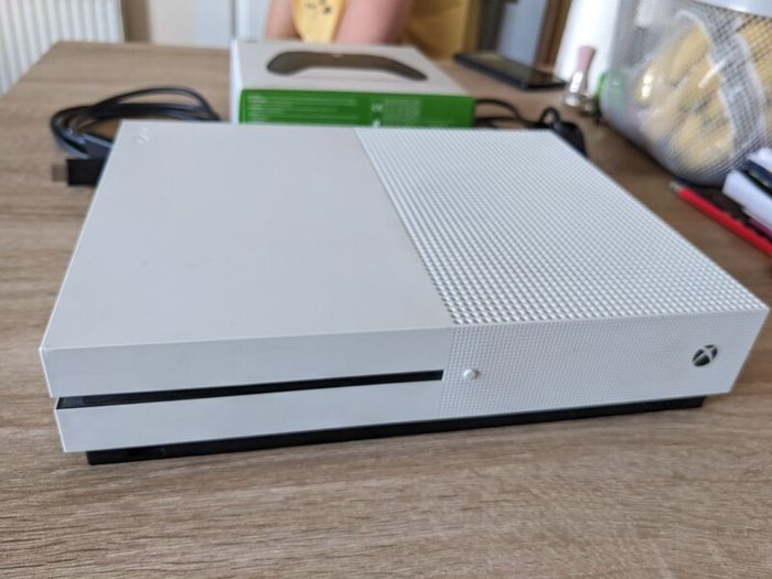 Xbox One S 1TB with controller and cables.