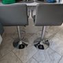Pair of grey faux leather bar stools with chrome base Image 3
