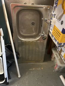Kitchen sink with taps