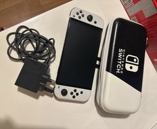Nintendo Switch OLED with box and unused accessories with case