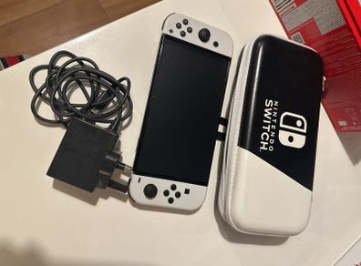 Nintendo Switch OLED with box and unused accessories with case