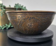 Middle Eastern repousse brass bowl with intricate engraving. 12cm in diameter x 5cm high