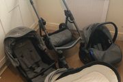 Venicci 3 in 1 travel system, including bag and rain covers.