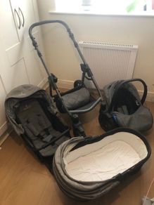 Venicci 3 in 1 travel system, including bag and rain covers.