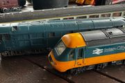 2 Hornby British rail engines and 2 British rail coaches. Don't have a controller so don't know if they work or not Hornby train