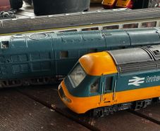 2 Hornby British rail engines and 2 British rail coaches. Don't have a controller so don't know if they work or not Hornby train