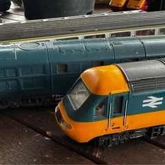 2 Hornby British rail engines and 2 British rail coaches. Don't have a controller so don't know if they work or not Hornby train