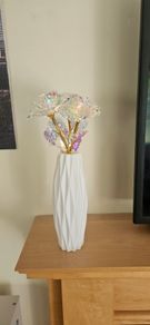 White vase with 3 golden roses