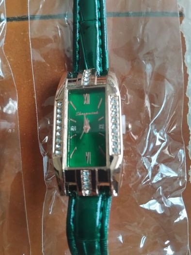 2 womans quartz watches with leather straps