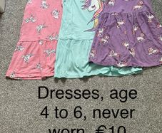Girls dresses, age 4 to 6, never worn