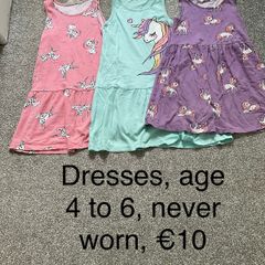 Girls dresses, age 4 to 6, never worn