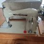 2 Sewing Machine one does zigzag right side main photo the other in left straight only just need a. Puller.  Both working Image 7