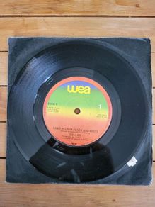 Dollar Hand Held In Black And White 7 inch Vinyl Single 1981 WEA BUCK 1