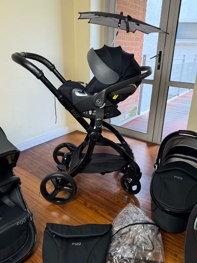 As New Egg2 travel system with Cybex car seat and isofix base swivel
