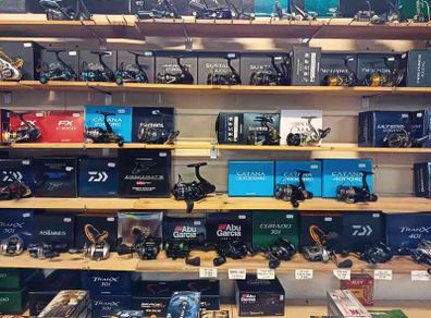 Fishing bait rods lines reels waders lures feeds jackets boxes rod holders and other fishing gear