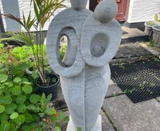 Abstract Stone Statue of Embracing Couple