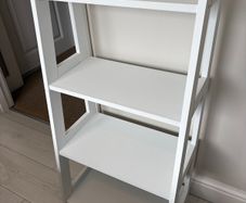 White ladder storage unit
