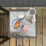 Brown rattan outdoor table and rocking chair Image 4