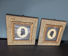 Pair of vintage silhouette portraits in ornate gold frames