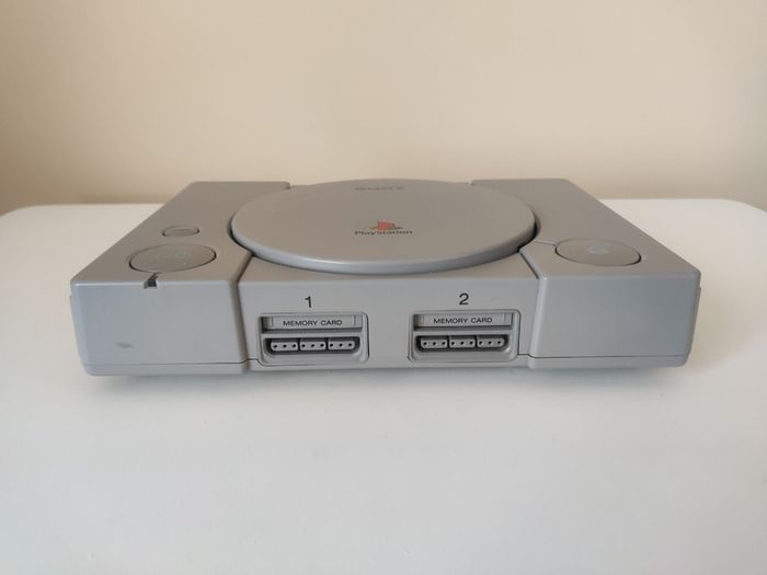 Playstation 1 console SCPH-7502 with games and cords