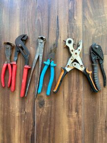 Assorted hand tools - pliers and punch
